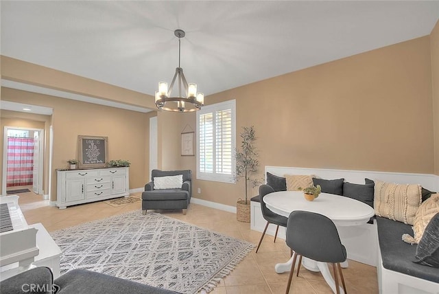 interior space featuring light tile patterned floors, an inviting chandelier, and breakfast area