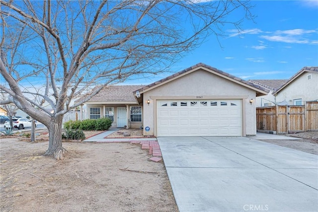 ranch-style home featuring a garage