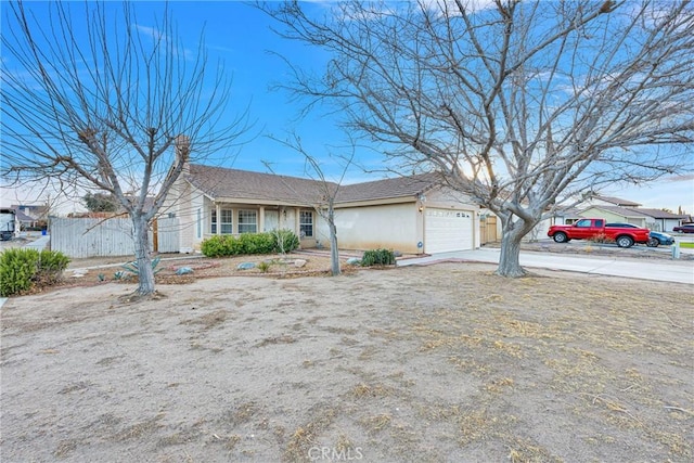 ranch-style house featuring a garage