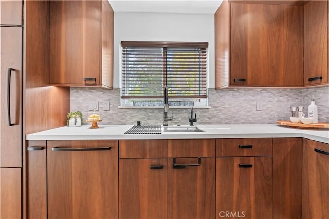 kitchen featuring sink and decorative backsplash