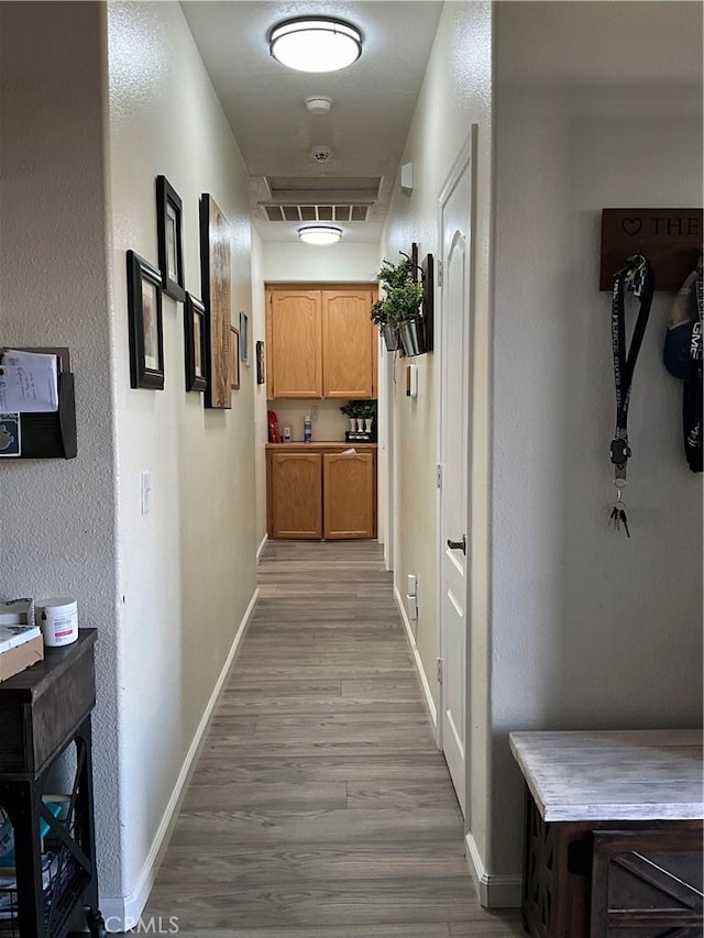 hallway featuring light hardwood / wood-style flooring