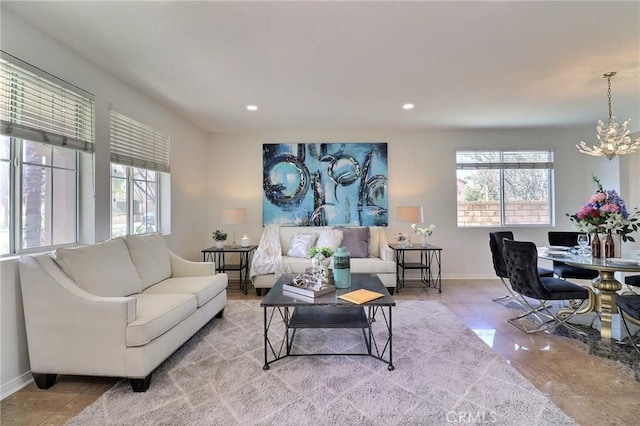 living room with an inviting chandelier and light tile patterned floors