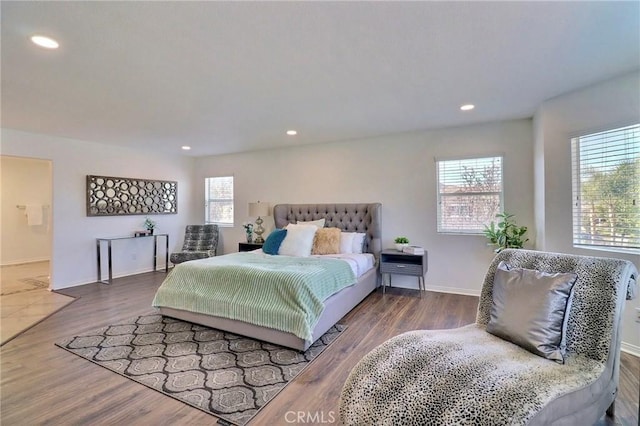 bedroom with hardwood / wood-style flooring