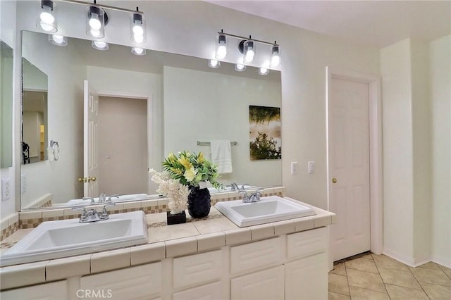 bathroom featuring tile patterned flooring and vanity