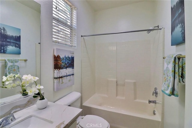 full bathroom with washtub / shower combination, vanity, and toilet