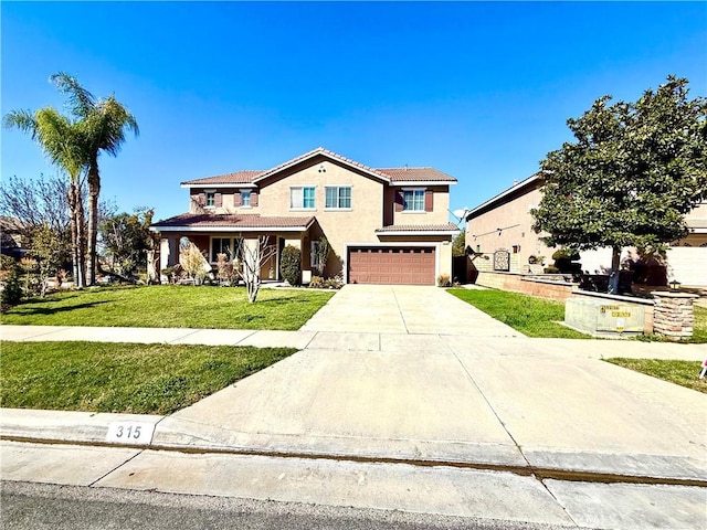 view of front of property with a garage, a tile roof, concrete driveway, stucco siding, and a front lawn