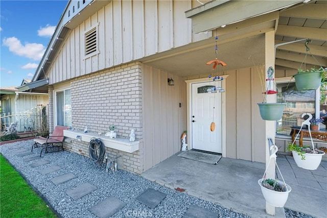 entrance to property with a patio area