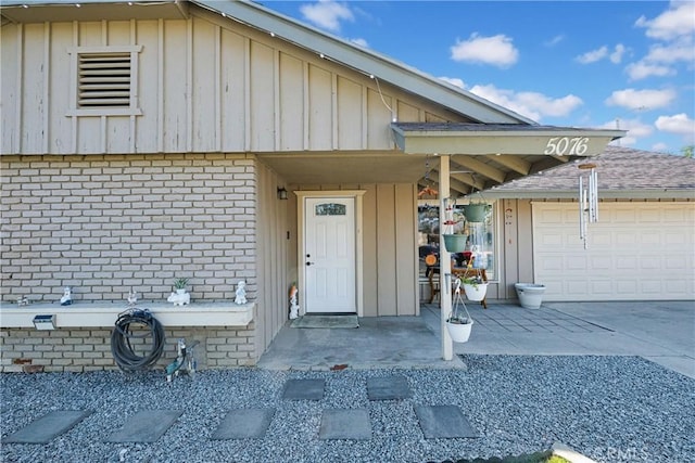 doorway to property featuring a garage