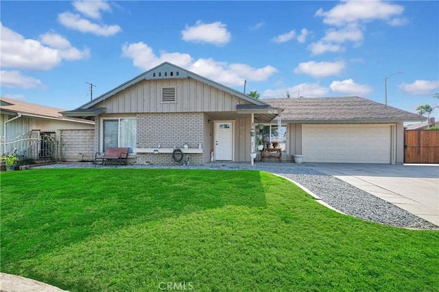 ranch-style house featuring a garage and a front yard