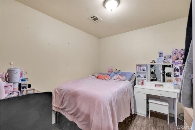 bedroom featuring dark hardwood / wood-style floors