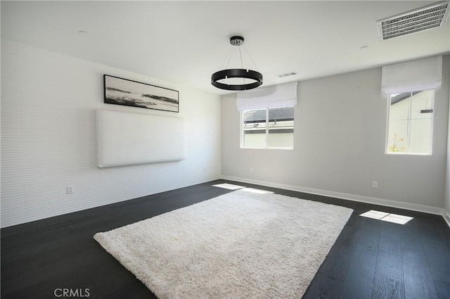 26235 Cherry Plum Cir, Menifee, CA 92584 - interior space featuring baseboards, visible vents, and dark wood-style floors
