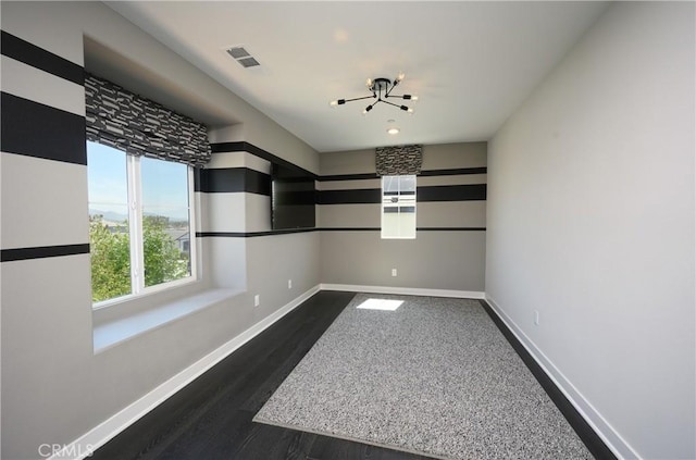 26235 Cherry Plum Cir, Menifee, CA 92584 - empty room with baseboards, visible vents, and dark wood-type flooring