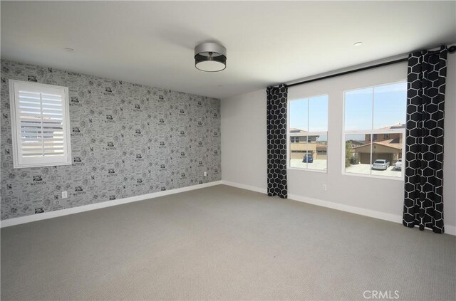 26235 Cherry Plum Cir, Menifee, CA 92584 - spare room featuring carpet floors, baseboards, and wallpapered walls