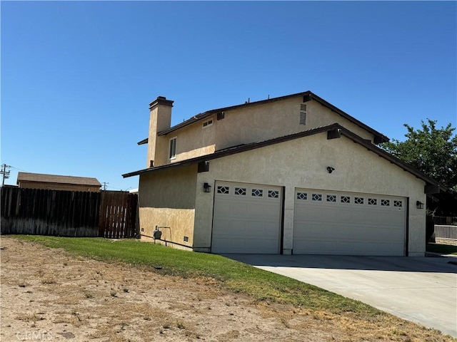 view of side of property featuring a garage