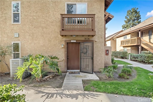 doorway to property featuring cooling unit