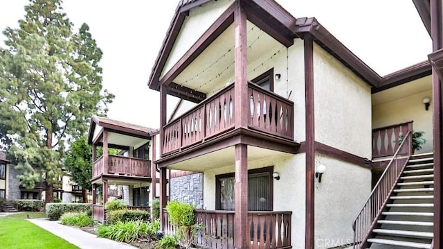 rear view of house featuring a balcony