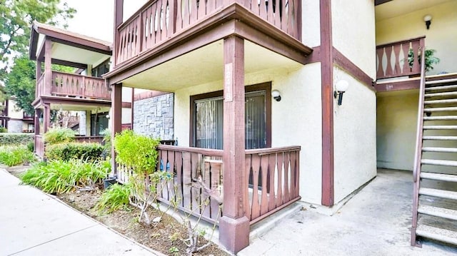 property entrance with a balcony