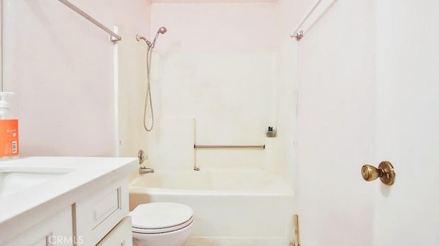 full bathroom featuring vanity, bathing tub / shower combination, and toilet