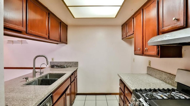 kitchen with sink, light tile patterned floors, and stainless steel range with gas cooktop