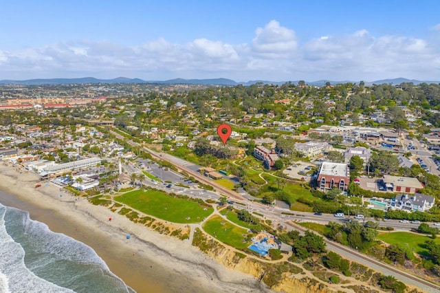 birds eye view of property featuring a beach view and a water and mountain view