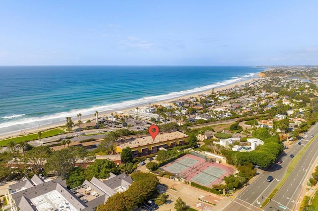drone / aerial view featuring a view of the beach and a water view