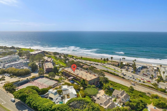 birds eye view of property featuring a view of the beach and a water view