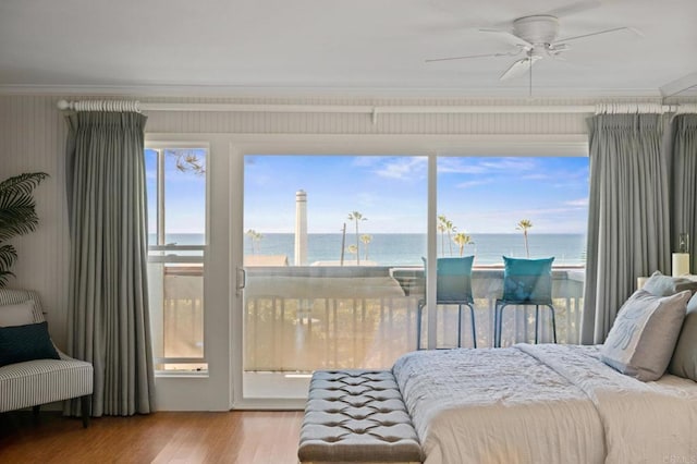 1562 Camino Del Mar Unit 440, Del Mar, CA 92014 - bedroom featuring a water view, multiple windows, ornamental molding, wood finished floors, and access to exterior