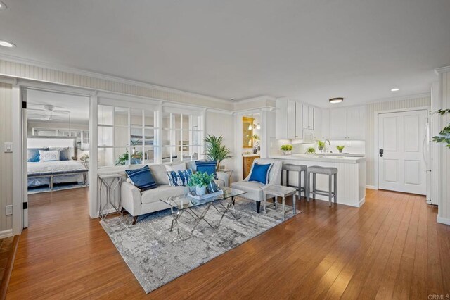 1562 Camino Del Mar Unit 440, Del Mar, CA 92014 - living room with hardwood / wood-style flooring, crown molding, and recessed lighting