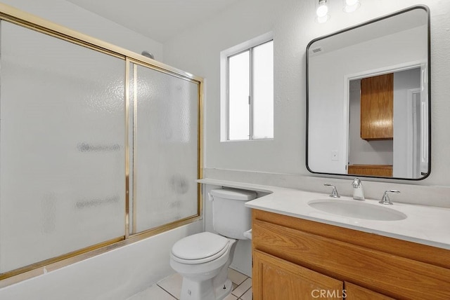 full bathroom with enclosed tub / shower combo, vanity, toilet, and tile patterned floors