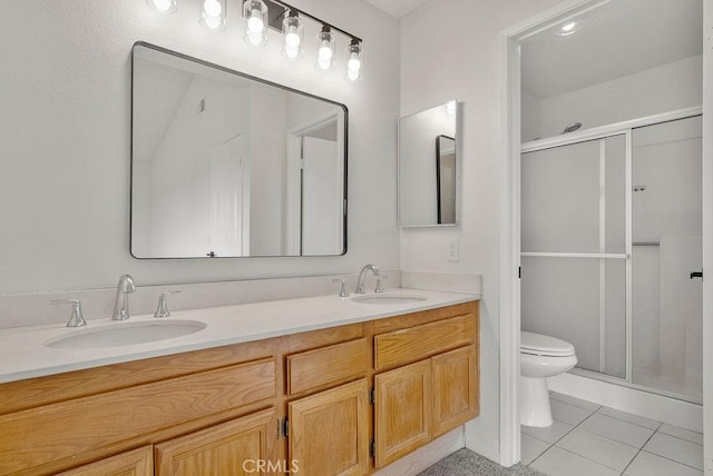 bathroom featuring walk in shower, tile patterned floors, toilet, and vanity