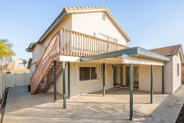 rear view of house featuring a patio