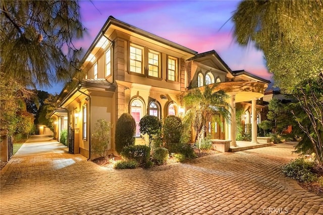 property exterior at dusk with a garage