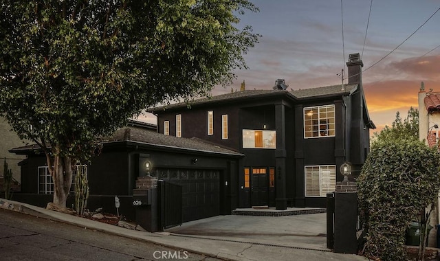 view of front of property with a garage