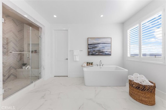 bathroom with separate shower and tub