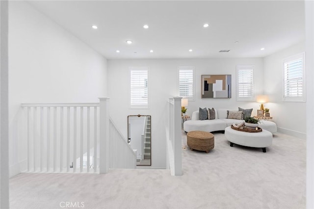 carpeted living room featuring a healthy amount of sunlight