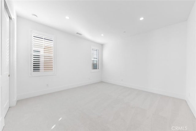 empty room with light colored carpet