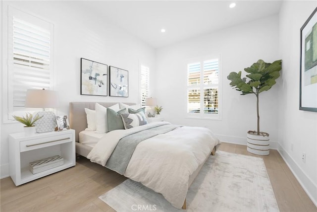 bedroom with light hardwood / wood-style floors