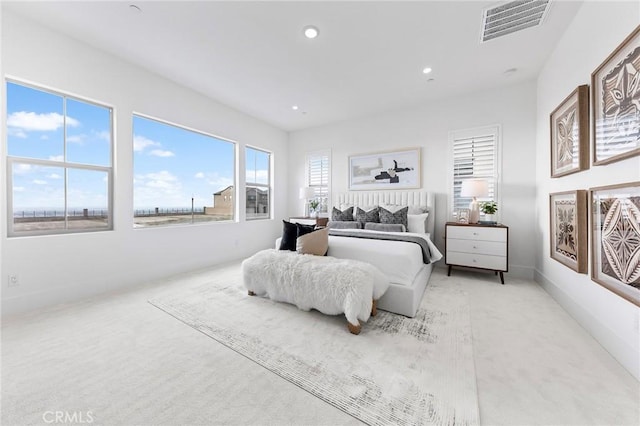 bedroom featuring light carpet