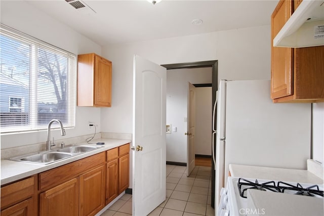 kitchen with sink and light tile patterned floors