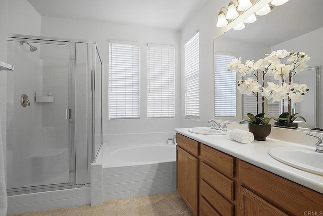 bathroom featuring independent shower and bath and vanity