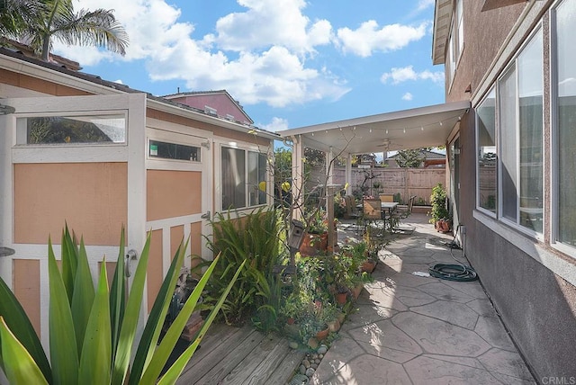 view of side of home with a patio