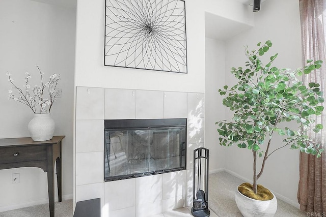 interior details with carpet flooring and a fireplace