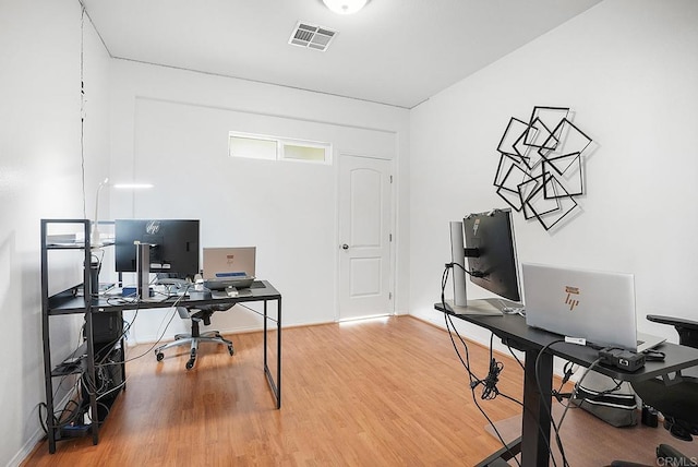 office area with hardwood / wood-style floors