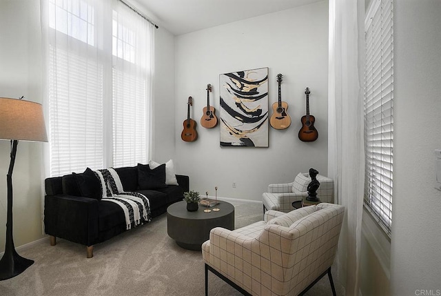 carpeted living room featuring a healthy amount of sunlight