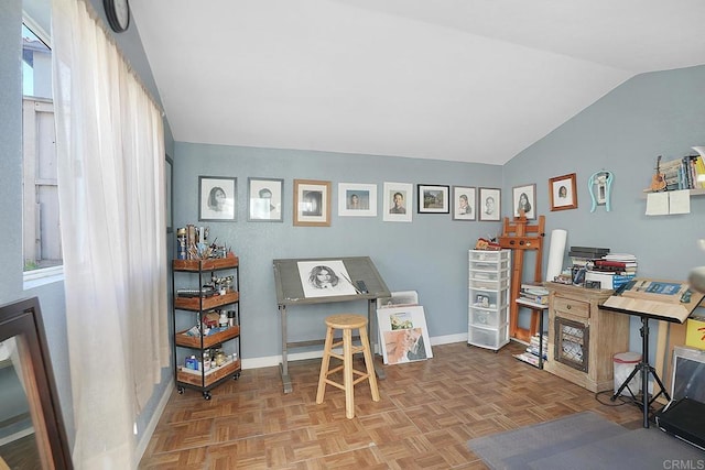 home office featuring vaulted ceiling and parquet floors