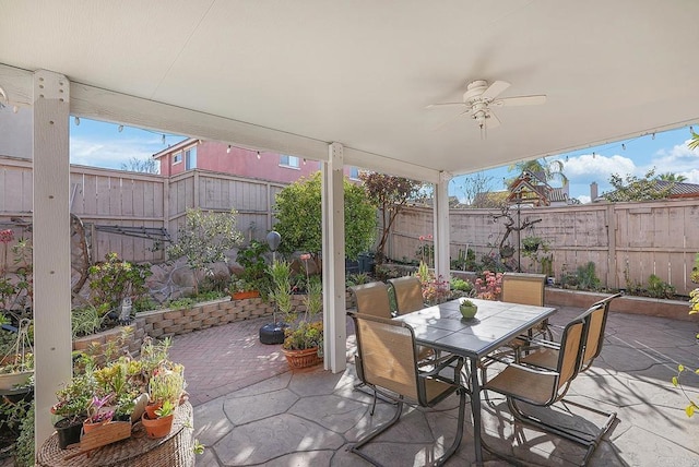 view of patio featuring ceiling fan