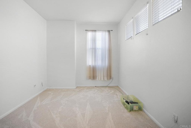 spare room with light carpet