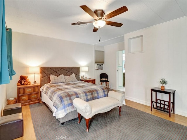 bedroom featuring wood-type flooring and ceiling fan