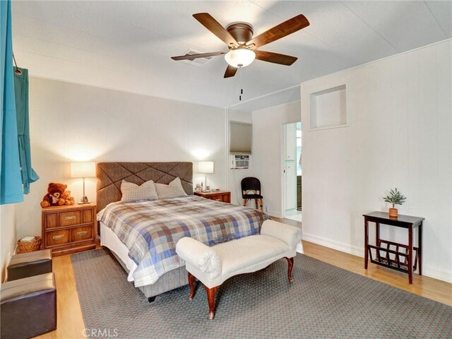 bedroom with wood finished floors and a ceiling fan