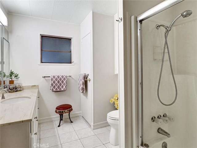 full bath featuring shower / bathing tub combination, toilet, vanity, tile patterned flooring, and baseboards